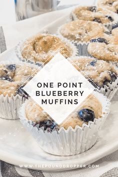 blueberry muffins on a white plate with the words, one point blueberry muffins