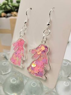 Easter bunny rabbit earrings. Made with resin and pink bunny glitter. Great for Easter! Sterling silver earring wires. Hypoallergenic. Ships on an earring card with a plastic protective cover. Glitter In Resin, Easter Bunny Earrings, Rabbit Earrings, Easter Earrings, Easter Jewelry, Bunny Earrings, Earring Card, Earring Wires, Easter Bunny Rabbit