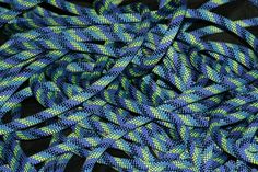 blue and green braided rope on black background