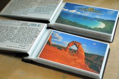 three open books sitting on top of a table next to each other with pictures inside them