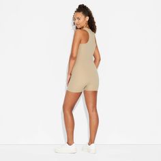 Gameday butter romper from Wild Fable™ in a solid shade with a sleeveless silhouette, wide straps and a short length. Crafted from lightweight interlock fabric with spandex. Rounded V-neckline, half-length zippered front and a racerback complete the design with sporty vibes. If you're not satisfied with any Target Owned Brand item, return it within one year with a receipt for an exchange or a refund. Wild Fable™: A look for every story. Fitted Sleeveless Bodysuit For Daywear, Solid Compressive Jumpsuits And Rompers, Sporty Compressive Jumpsuits And Rompers For Summer, Sleeveless Jumpsuits And Rompers For Daywear, Sleeveless Beige Bodysuit For Summer, Sleeveless Stretch Beige Jumpsuits And Rompers, Casual Jumpsuits And Rompers With Seamless Construction, Sporty Sleeveless Seamless Jumpsuits And Rompers, Beige Sleeveless Stretch Jumpsuits And Rompers