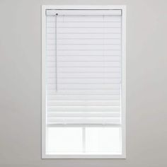 a white window with the blinds closed