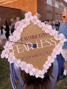 a graduate's cap with the words fearless written on it in front of other graduates