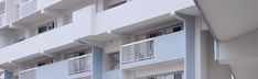 an apartment building with balconies and windows