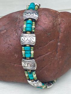 "Mens Turquoise Bracelet, Mens Valentine Gift, Southwest jewelry gift, Mens Turquoise Jewelry, mens beaded bracelet, gifts for him. This is one of my Best Sellers! With genuine turquoise! I've always thought it take a special kind of man to know what kind of jewelry to wear. This is a strong, masculine and expressive piece. It's made of genuine turquoise heishi beads, African brass beads and glass seed beads. Finished off with my favored, double snake spacer beads. It's perfect for the man with Rustic Handmade Turquoise Beaded Bracelets, Handmade Southwestern Turquoise Beaded Bracelets, Nickel-free Turquoise Beaded Bracelets, Southwestern Style, Southwestern Turquoise Beaded Bracelets With Spacer Beads, Nickel-free Southwestern Turquoise Beaded Bracelets, Southwestern Turquoise Nickel Free Beaded Bracelets, Southwestern Turquoise Nickel-free Beaded Bracelets, African Brass Beads, Mens Valentines Gifts