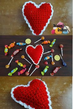 crocheted heart with pins attached to it and candy on the table next to it