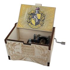 a wooden box with a hogwarts crest on it