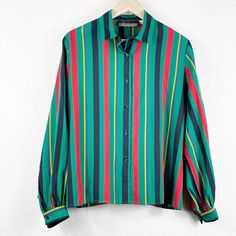 Vintage Lady Manhattan Green Multicolor Bold Vertical Stripe Button Up Shirt 80s 90s Office Career Top Long Sleeves GUC. In great pre-owned condition. There is no size tag but measures like a large, x large with the length from shoulder to hem being about 25 inches long and measuring about 23 inches flat across the chest. Would pair perfectly with a black pencil skirt or black pants. Please see all photos. Made in Taiwan. Vintage Multicolor Button-up Shirt, Retro Green Button-up Top, Retro Green Top With Buttons, Retro Green Button-up Blouse, Vintage Green Button-up Shirt, Vintage Multicolor Shirt With Buttons, Retro Green Button-up Shirt, Retro Multicolor Tops With Button Closure, Vintage Multicolor Blouse With Button Closure