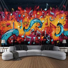 a couch sitting in front of a wall with musical notes on it