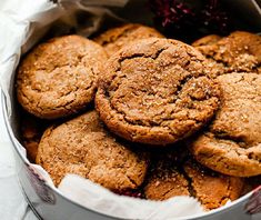 a tin filled with cookies sitting on top of a table