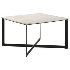 a white marble top coffee table with black metal legs and an iron frame around it