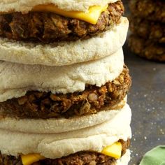 a stack of four sandwiches sitting on top of a table