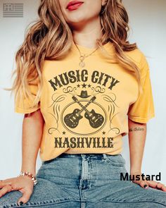 "PRODUCTION TIME: 1-3 days (Usually 2 days) SHIPPING TIME: 2-5 days (Usually 3 days) 👕PRODUCT DESCRIPTION👕  Step into the heart of country music with our \"Nashville Music City\" t-shirt. This vintage-inspired tee is the perfect addition to any music lover's wardrobe. Featuring a classic guitar design and a retro Music City logo, this shirt is made from comfortable and durable garment-dyed material. Whether you're exploring the city or attending a concert, this tee is sure to become your go-to Nashville Music City, Music City Nashville, Nashville Music, City Logo, Nashville Style, Country Music Shirts, Music Tees, Music City, Retro Music