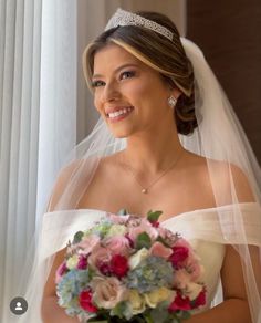 a woman in a wedding dress holding a bouquet