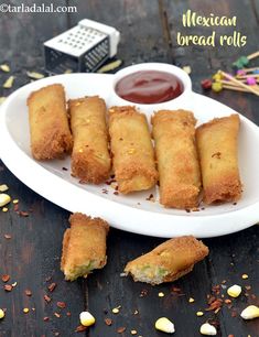 mexican bread rolls on a plate with dipping sauce