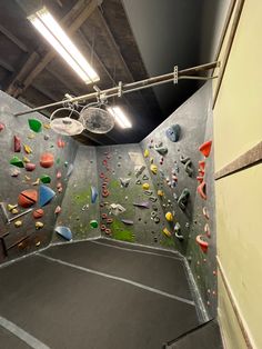 an indoor climbing wall in a gym