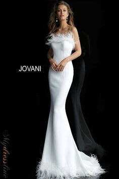 Looking for an unforgettable wedding dress? Look no further than the Jovani 63891. This show-stopping gown features a strapless fitted bodice, mermaid skirt with feather trim and flared tail end, and a train that will make you feel like a goddess on your big day. Whether you're planning a traditional or informal wedding, this dress is sure to turn heads and make your special day even more magical. Evening Gown Wedding, Lilli Luxe, White Evening Gowns, Informal Weddings, Prom Dress Evening, Mermaid Evening Gown, Mermaid Prom Dress, Unique Prom Dresses, Feather Trim