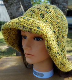 This hat is stylish sun protection and is machine washable. Dress it up with a scarf or flower. Cotton Sun Hat, Yellow Crochet Beach Hat, Yellow Knitted Crochet Hat For Spring, Brimmed Crochet Hat For Spring Outdoor, Yellow Yarn Beach Hat, One Size Wide Brim Crochet Hat For Warm Weather, Yellow Knitted Beach Hat, Yellow Hand Knitted Beach Hat, Casual Yellow Crochet Sun Hat