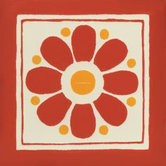 a red and white square with an orange flower in the center on a red background