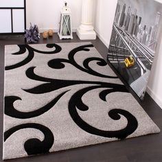 a white rug with black swirls on it