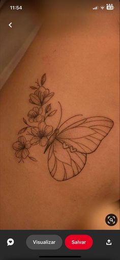 a tattoo with a butterfly and flowers on it