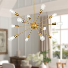 a chandelier hanging from the ceiling in a living room