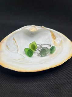 These rings are made out of authentic beach glass that is found on Long Island, NY. These cute , minimal rings look great paired with anything. Also unlike other rings, these don't leave that nasty green ring around your finger after a shower or putting it in the water. These rings are a size 7 1/4 in US sizing but you can also make them tighter or looser to fit your finger with a pair of pliers.  PLEASE KEEP IN MIND THAT ALL RINGS ARE DIFFERENT All orders over $35 get free shipping! Check out m Minimalist Toe Ring Jewelry For Beach, Minimalist Beach Ring Jewelry, Minimalist Beach Jewelry Ring, Handmade Adjustable Sea Glass Rings, Minimalist Sea Glass Jewelry For Beach, Sea Glass Wedding, Womens Rings, Beachy Jewelry, Sea Glass Ring