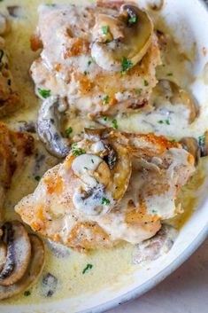 chicken with mushrooms and gravy in a white bowl