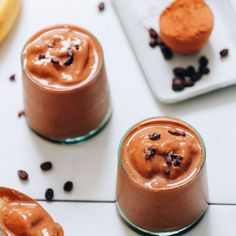 three desserts with chocolate and coffee on the table