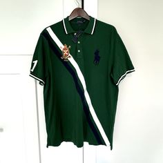 Polo Ralph Lauren Classic Fit Green White Navy Stripe Short Sleeve Shirt New With The Tag Size: Xl Material: 100% Cotton Care: Machine Wash/Dry Clean Classic Fit Pullover Point Collar 3 Button Neckline Short Sleeves Right Sleeve With White Embroidered "1" Left Chest With Navy Embroidered Pony Right Chest With Embroidered Crown Polo Straight Hemline With Side Vents New With The Tag, Never Worn! Approx. Measurements: Across The Underarms: 24" Sleeve Length From Shoulder Seam: 9.75" Length Down The Green Cotton Tops With Casual Collar, Green Cotton Top With Casual Collar, Fitted Green Polo Collar Top, Embroidered Crown, Striped Short Sleeve Shirt, Lauren Green, Ralph Lauren Shirt, Navy Stripes, Polo Ralph Lauren Mens