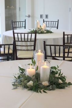 a table with candles and flowers on it