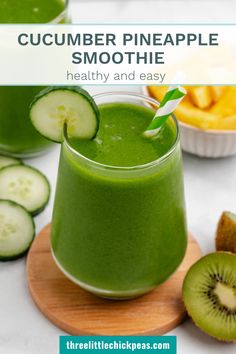 cucumber pineapple smoothie in a glass with sliced kiwis on the side