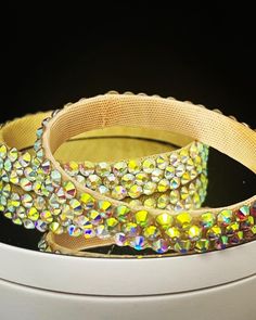 Elevate your dance game with our premium-quality bracelets designed for all dance enthusiasts! These bracelets feature three rows of high-quality rhinestones that sparkle and shine as you move to the rhythm! Customize your bracelet to fit perfectly by specifying your size during the ordering process. No worries about color choices - we've got all shades of rhinestones available. Adjustable Sparkling Bangle For Party, Sparkling Bangle For Parties, Adjustable Crystal Bangle For Party, Party Crystal Bracelet With Bling, Party Crystal Bangle, Sparkling Stones Round Bangle For Party, Round Bangle With Sparkling Stones For Party, Party Bracelet With Rhinestones, Dazzling Crystal Bangle For Parties