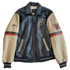 Resurrection is offering a vintage unisex leather bomber by Ruff Ryders with a color block design, patches, and embroidery. This varsity bomber jacket is fully lined with quilted satin and has interior and exterior pockets. * Ruff Ryders * Non-Branded Vintage * Size: XL * Measurements: Arm length - 27", Opening - 23", Waist - 26", Chest - 19", Length 28.5", Shoulder - 21" * Fabric Leather * Excellent Vintage Condition  * Wear Consistent With Age * Authenticity Guaranteed Vintage Biker Jacket With Zipper For Streetwear, Vintage Motor Jacket, Bombers Leather Jacket, Vintage Distressed Leather Jacket For Streetwear, 80s Bomberjack, Varsity Leather Jacket, Ruff Ryders, Vintage Varsity Jacket, Graphic Jackets