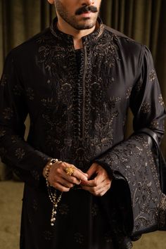 A black cotton silk kurta and pajama set with floral patterns merged with an inner border details, further accentuated with all over sequin details. 

Color: Black
Fabric: Cotton Silk Kurta Pajama, Mens Luxury Fashion, Kurta Designs, Wedding Wear, Floral Patterns, Cotton Silk, Black Fabric