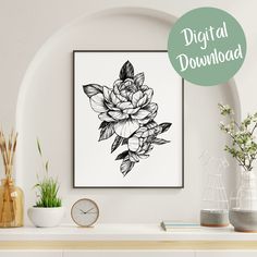 a black and white floral art print on a wall above a mantle with potted plants