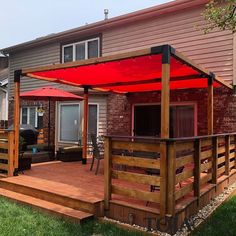 a wooden deck with an umbrella over it