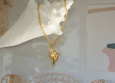 Add a touch of seaside charm to your look with this stunning Gold Conch Shell Necklace. This minimalist seashell jewelry piece is perfect for the boho beach lover in your life. Treat yourself or surprise her with this unique seashell jewelry for her, a thoughtful Mother's Day gift that will surely make her day. Handcrafted with love, this beach-inspired necklace is a must-have accessory for anyone who adores the beauty of the ocean. 16" as shown on the pictures. pendant size:8mm x 15mm material: Elegant Starfish Charm Necklace For Beach, Beach Jewelry With Charms In Ocean-inspired Style, Ocean-inspired Strand Charm Necklaces As Gift, Ocean-inspired Strand Jewelry With Starfish Charm, Ocean-inspired Jewelry With Charms For Beach, Ocean-inspired Beach Jewelry With Charms, Starfish Charm Strand Jewelry For Gift, Starfish Charm Strand Jewelry Gift, Gold Shell Necklace With Starfish Charm On Strand