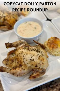 a white plate topped with chicken next to a bowl of dip and potato salad on top of it