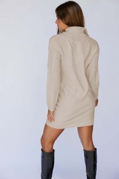 Keep super warm this season in the new Jye cable knit mini dress by SNDYS. Features a turtle neck collar to keep you warm and a ring pull zip to open up the front section. This knit dress in Beige will let you pop the collar and create a V neckline, or pull up the sleeves and style your way. Length Small is 87 cm from shoulder to hem. Fabric: 100% Acrylic Model : Leilani is a XS/6 wearing a XS/6 Her measurements: are Height 177cm / Bust 76cm / Waist 61cm / Hip 89cm Care Instructions: Wash in cold water Do not bleach Hang Dry in Shade Gently pull on garment to return to shape Iron or Low setting Dry Cleanable (X) Winter Cable Knit Mini Sweater Dress, Winter Mini-length Solid Color Sweater Dress, Fall Cable Knit Turtleneck Sweater Dress, Chic Beige Cable Knit Sweater Dress, Winter Cable Knit Mini Dress, Winter Cable Knit Turtleneck Sweater Dress, Cozy Mini Dress For Winter, Beige Mini Sweater Dress For Winter, Beige Turtleneck Sweater Dress For Winter