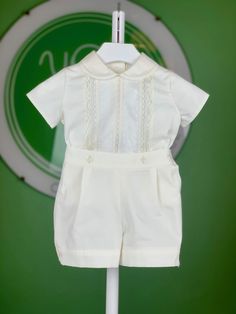 Cotton and lace boys traditional buster suit. A cute little peter pan collar Button fastenings on front of shorts & back of the shirt The super soft shorts have a useful, adjustable back waistband and gently elasticated cuffs. 2 piece set Perfect for a baptism, christening or special occasion Sizing chart is in centimeters (cm) Machine wash 30*C Hypoallergenic tested 63% polyester 37% cotton Made in Spain White Lace Shorts Outfit, Baby Baptism Outfit, White Lace Outfit, Lace Short Outfits, White Shorts Outfit, Bubble Clothes, Boy Baptism Outfit, Traditional Suit, Dapper Dudes