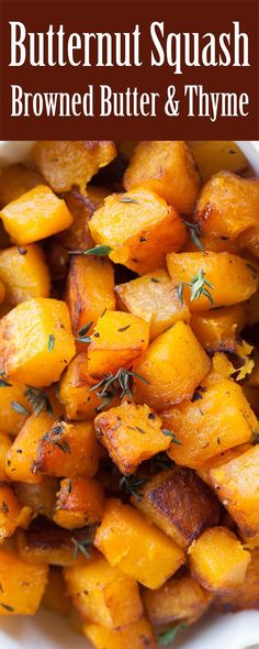 roasted butternuts with herbs in a white bowl