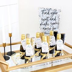 several bottles of wine on a gold tray