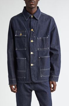 Railroad-striped denim underscores the utility aesthetic of this workwear-inspired jacket detailed with contrast topstitching and flower-shaped buttons. 29" length (size Medium) Front button closure Spread collar Button cuffs Chest button-flap patch pocket; chest patch pocket; front patch pockets; interior patch pocket 100% cotton Dry clean Made in Portugal Designer Clothing Spring Pinstripe Outerwear With Pockets, Workwear Denim Jacket With Contrast Stitching, Denim Jacket With Contrast Stitching For Work, Cotton Denim Jacket With Contrast Stitching For Work, Striped Button-up Outerwear With Pockets, Utility Aesthetic, Contrast Topstitching, Striped Denim, Workwear Jacket