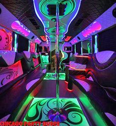 the inside of a party bus decorated with neon lights