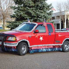 a red pick up truck with an american flag painted on it