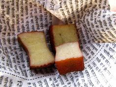 two pieces of bread sitting on top of a piece of paper