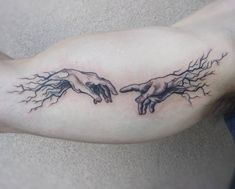 two hands touching each other with lightning coming out of them tattoo on the left arm