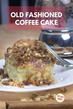 an old fashioned coffee cake on a white plate with a fork in front of it