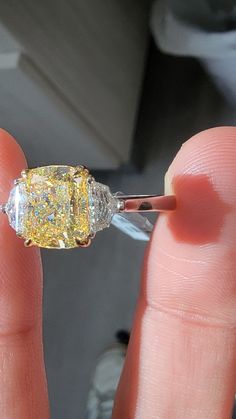 As much as all yellow diamonds want to look like the sun- this one really does. Absolutely dripping with color, no patches of emptiness in the stone; completely vibrant and beautiful Set in Platinum and 18kt Yellow Gold with 0.58ct of Epaulettes Dazzling Brilliant Cut Yellow Diamond Ring, Dazzling Yellow Brilliant Cut Diamond Ring, Luxury Yellow Diamond Ring, Yellow Oval Brilliant Cut Diamond Ring, Yellow Brilliant Cut Diamond Ring, Dazzling Yellow Diamond Ring With Center Stone, Yellow Diamond Ring With Center Stone, Dazzling Yellow Rings With Halo Setting, Yellow Diamond Ring With Halo Setting For Promise